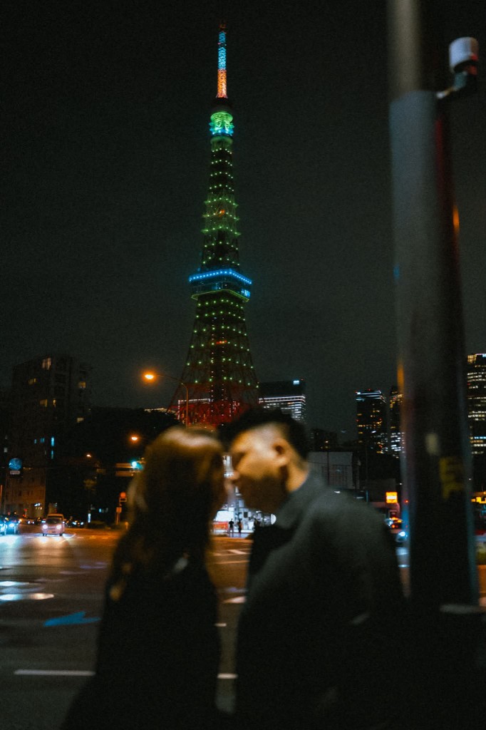 Rey and Kim with the tower lit behind them